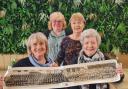 L-R Marjorie Brewer (nee Tomkins) Sue Perryman (nee Coles) Sue Tuthill (nee Spurway) Jane Preece (nee Collins), with a 1964 photo of The King's School pupils