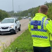 Police officer monitoring speed on the A30