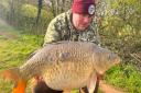 Scott Bryant with an 18lb Carp from Newbarn Angling Centre