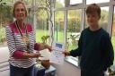 Wilf Laney-Hubbard receives his award from Rotarian Maureen De Viell