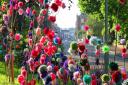 A dazzling display of colourful pom poms alongside Rolle Road for the Exmouth Festival Art Trail. Ref exe 22-16SH 6755. Picture: Simon Horn.