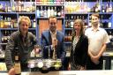 Harry Tucker, Simon Jupp MP, Andrea Tucker and Michael Dance behind the bar of the Exmouth Hotel