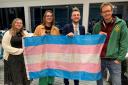 East Devon councillors Jake Bonetta and Joe Whibley with the Transgender flag