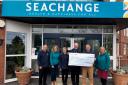 Exmouth Town Concert Band presented a cheque to Seachange Budleigh, Marc Jobson.