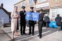 Alison Hernandez and police officers at official opening of front desk at Honiton Police Station