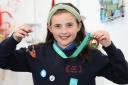Carys Iona Turner, Ysgol Dyffryn Trannon, Trefeglwys won third place for her necklace - which was made out of a biscuit tin!