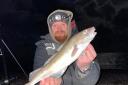Chris Wagstaff with a small Cod