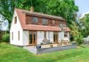 The three bedroom chalet style bungalow sits on a plot of around 0.5 acre