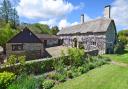 This handsome chocolate-box thatched cottage is sited in the Farway Valley