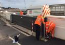 One of Exmouth's flood barriers being closed as Storm Eunice approaches