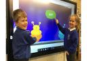 Children enjoying the nee interactive screens