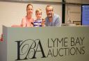 Simon and Susie Watson with their son Max at Lyme Bay Auctions. Ref edr 31 19TI 9214. Picture: Terry Ife