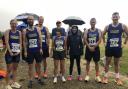 Harriers braving the rain before the start of the Run Exe 5km