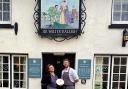 Dan Kavanagh and Amber from the Sir Walter Raleigh with their rosette award