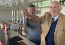 Lord Clinton pulling the first pint at the cricket club's opening event last November, with treasurer Andy Drodge