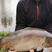 John Selley with a double figure Mirror Carp from Newbarn Angling Centre
