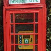 The restored phone box with its Defibrillator' sign
