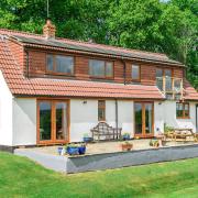 The three bedroom chalet style bungalow sits on a plot of around 0.5 acre