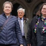 Cathy Gardner (2nd left) and Fay Harris (2nd right), whose fathers died from Covid-19, leave the Royal Courts of Justice, central London