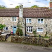 The charming four bedroom house sits in the pretty village of Whitford