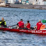 An Exmouth Rowing Club crew being oput through their paces off shore. Picture LES NORCLIFFE