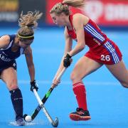 Great Britain's Lily Owsley (right) and Chile's Carolina Garcia battle for the ball during the FIH Hockey Olympic Qualifier at Lee Valley Hockey and Tennis Centre, London.