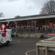 Rotary Club of Exmouth Raleigh's santa rolled in to Bassett's Farm Primary School
