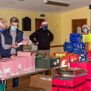 Budleigh Lions Club members making hampers for struggling families in the town