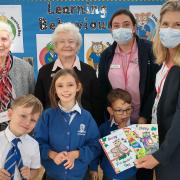 Residents of Raleigh Manor with staff members, Kirstie Cobb and Louise O’Sullivan and children from Brixington Primary Academy with the winning cards. Credit Barchester Care.