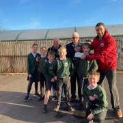 Budleigh Freemasons present a cheque to St Peters School. Credit Budleigh Freemasons.
