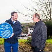 Simon Jupp with the blue plaque and All Saints Church vicar Martin Jacques