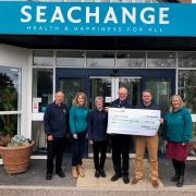 Exmouth Town Concert Band presented a cheque to Seachange Budleigh, Marc Jobson.
