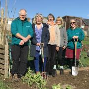Kathryn Hope,  Seachange Activity and Volunteer Co-ordinator (second left) with Gina Martin and Sharon Rehbock from Budleigh Flower and Produce Show, and Seachange allotment workers