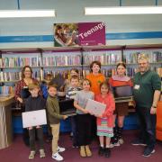 Children from Exmouth Library's CoderDojo club with the new laptops.