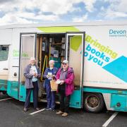 One of Devon's mobile library vans, with users of the service.