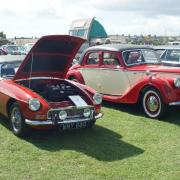 The line-up of individual classic cars includes (left to right) an MGB Roadster and a Riley RMA.