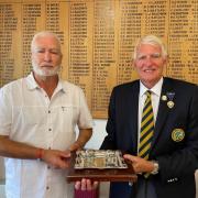 Madeira captain Dave Moody surrenders the Inkstand Trophy to Winscombe