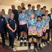 Brixington Blues players and club members with Budleigh Salterton Lions
