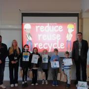 Lions Richard and Sue, and Jessica from Suez  Recycling and Recovery, with pupils at the special school assembly