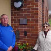 Betty Ford and Dick Francis, President of Exmouth Rotary, with the plaque at the Juniper Centre