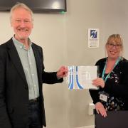 Councillor Davey making a presentation to Lisa Pike, CEO of Open Door