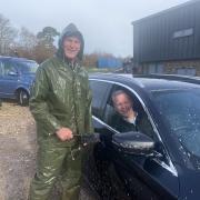 Neil Murrin cleans the car of club treasurer Andy Drodge