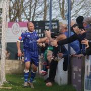 Ace High celebrates his second, and Exmouth's third goal, with the home fans