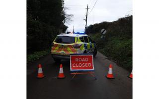 Devon and Cornwall Police have closed the road